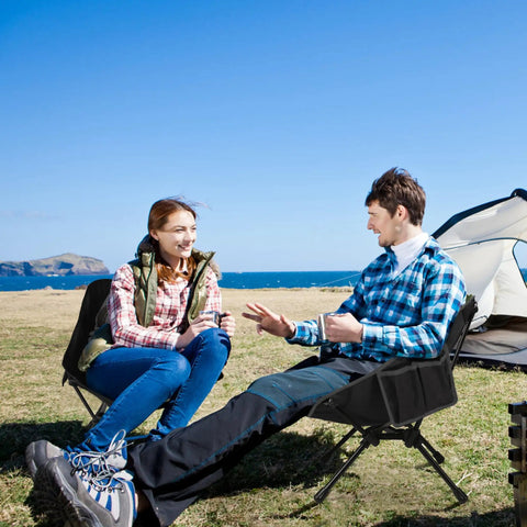 Two people sitting on Ultralight Camping Chair For Backpacking And Travel, Portable Folding Seat at beach, tent in background