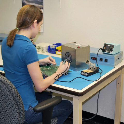 Person using Portable Solder Smoke Fume Extractor For Soldering, Jewelry Making, And Crafting, ESD Safe Base on a workbench