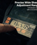 Close-up of a panoramic welding helmet display showing shade adjustment range and controls for the auto-darkening filter feature.