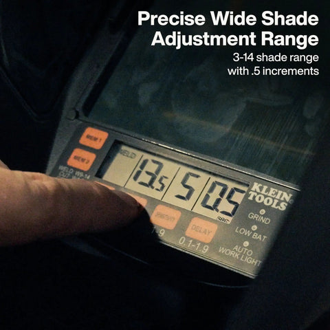 Close-up of a panoramic welding helmet display showing shade adjustment range and controls for the auto-darkening filter feature.