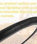 Close-up of 700x25c Road Bike Tire With brushed surface and lightning bolt pattern for grip, on a background bike wheel.