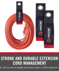 Heavy Duty Extension Cord Organizer With Large 18 Inch Straps For Slick Garage Wall Storage, holding a 100ft cord.