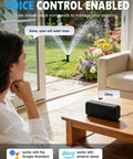 Woman using 2 Zone WiFi Sprinkler Timer With App Control in living room, controlling garden sprinklers via voice with Alexa.