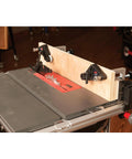 Kickass Flex Stock Guide For Portable Table Saw with slick rollers, mounted on saw for precise cuts on wood.