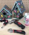 Tiny But Mighty Stubby Tool Set For Small Hands And Tight Spaces Includes Mini Hammer, Mini Screwdriver Set And Mini Wrench In Bright Red on table with painted birdhouses and paint bottles in background