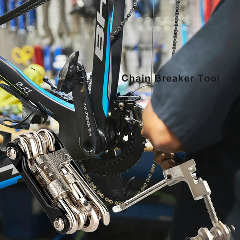 All In One Bike Multitool Kit With Chain Breaker And Tire Repair used on chain, showing lightweight stainless steel construction