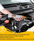 Grease Monkey Pick Fluid Extractor Pump With 39 Inch Hose And Reinforced Extension Tubes in use under car hood for fluid extraction.