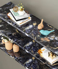 Blue marble peel and stick wallpaper covers shelves, featuring decorative items. Marble Peel And Stick Wallpaper For Countertops And Surfaces DIY Friendly No Mess Install Waterproof Vinyl Self Adhesive Countertop Cover Removable For Kitchen Bath Desk Or Dresser Makeover.