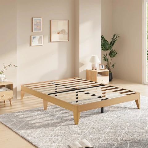Queen Wood Platform Bed Frame With Solid Wooden Legs And Heavy Duty Slat Support For A Room Refresh in a light-colored modern bedroom.