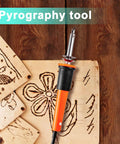 Front view of Honoson electric hot knife tool with orange handle and metal tip on a wooden pyrography board