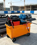 Heavy Duty Thread Rolling Machine For Steel Rods And Rebar Pro Grade Metal Thread Forming Equipment For Bolts And Steel Components Industrial Strength For Construction And Fabrication Projects on orange cart at construction site
