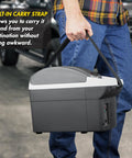 Compact 6 Quart Thermoelectric Cooler And Warmer For Car Rv And Truck, portable mini fridge with carry strap being held.