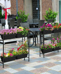 32 Inch Tall Elevated Raised Garden Bed With Trellis And Sturdy Legs For Vertical Outdoor Gardening In Black on a patio
