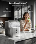 Solid Countertop Nugget Ice Maker Goes Hard On Rapid Cooling Spits Out Hella Chewable Pebble Chunks Quickly Generates Thirty Five Pounds Daily For Any Setup on kitchen counter with ice and woman holding a drink.