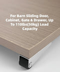 Close-up of vertical door support wheel showing rubber tread, designed for 110 lbs capacity on barn doors and furniture drawers. Set Of Four Heavy Duty Vertical Door Support Wheels Engineered To Stop Sag Dead In Its Tracks While Featuring Truly Dead Silent Rubber Tread Casters That Glide Smooth As Butter On Barn Doors And Furniture Drawers.