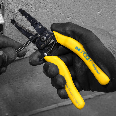 Reflex Super NM Cable Stripper For 12/2 And 14/2 Solid NM Wire, gloved hand using dual stripper heads tool
