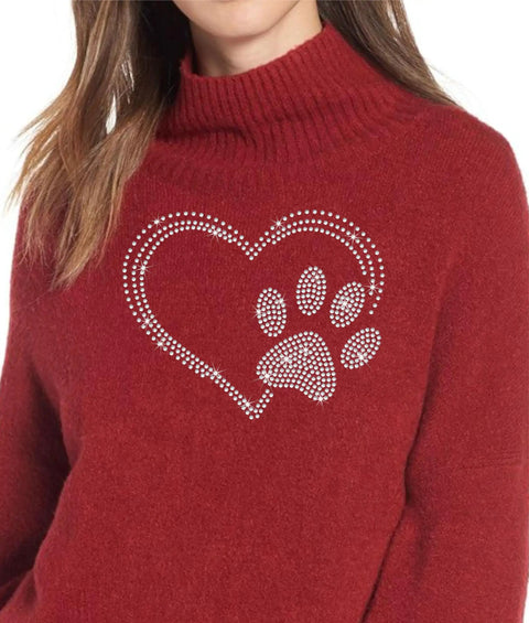 Woman wearing red sweater with Crystal Clear Hotfix Rhinestone Iron On Transfer With 10ss Gems, Heart With Paw Print Design.