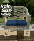 Outdoor Chair Cushions Set Of 4 19 By 19 Inch Navy Blue All Weather Water Resistant And Fade Resistant Patio Seat Pads With Ties Removable Covers Non Slip Bottom installed on a wicker chair outdoors.