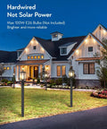 Hardwired 120V Dusk To Dawn Outdoor Post Light Black Exterior Lantern With Pier Mount Base in front of house at night