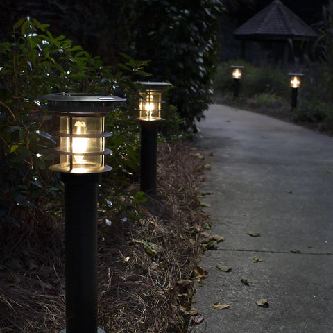 Solar Pathway Light With Stainless Steel Bollard, Waterproof Outdoor Landscape LED Lamp illuminating garden walkway.