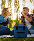 Couple enjoying drinks with Nautical Style Insulated Cooler Tote For Travel And Picnics Large Lunch Bag Beach Ready Car Cooler.