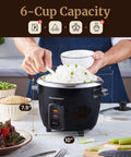 Person serving rice from 6-Cup Electric Rice Cooker With Stainless Steel Inner Pot For Fluffy Rice Every Time, Easy One-Touch Cooking