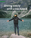 Man showcasing Tankless Underwater Breathing System With Rechargeable Waterproof Air Compressor And Regulator in backpack at lake
