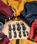 6 Pack Black Zipper Sliders Pullers Repair Kit For Coats Jackets And Luggage Instant Fix Zipper Set Replacement Fasteners Easy To Use Repair Tool For Broken Zips displayed with colorful jackets.