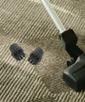 Upgrade Your Home Hustle With Six Pack M8 Steam Cleaner Brush Heads on carpet with vacuum, featuring nylon and plastic bristles.