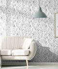 Gray Leaf Peel and Stick Wallpaper Dope Look Floral Self Adhesive Watercolor Leaves for Cabinets and Walls Removable Botanical Contact Paper Easy Peel and Stick Vibe Elegant Gray Wall Decor 17.7 by 394 Inches covering a living room wall with a modern sofa and lamp.