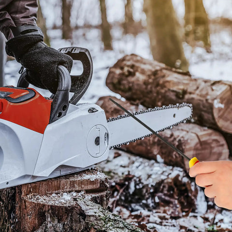 View of 3 pack chainsaw file set with 5/32 inch, 7/32 inch, and 3/16 inch round sharpening files used on a chainsaw outdoors.