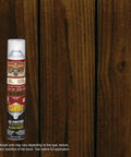 Top Shelf Dark Walnut Exterior Wood Stain and Sealer Turbo Spray System Oil Based Goof Proof Formula for Decks and Fences bottle against wood background.