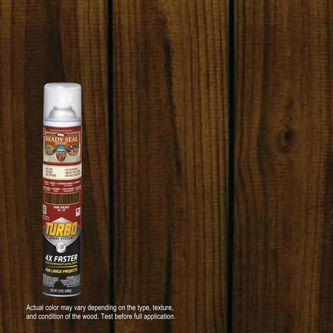 Top Shelf Dark Walnut Exterior Wood Stain and Sealer Turbo Spray System Oil Based Goof Proof Formula for Decks and Fences bottle against wood background.