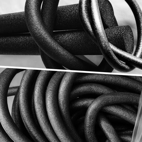Market Grade Foam Backer Rod For Reliable Gap Sealing And Concrete Crack Filling, Heavy Duty Caulk Saver Joint Rope 1 Inch By 10 Feet, twisted black foam cords stacked together.