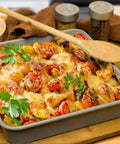 Casserole pan with roasted vegetables using Air Fry Crisping Basket And Tray Set With Nonstick Bake Pan And Roasting Sheet.