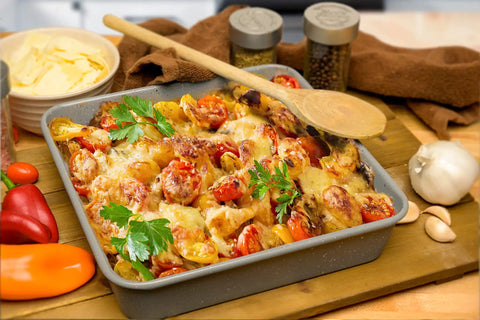 Casserole pan with roasted vegetables using Air Fry Crisping Basket And Tray Set With Nonstick Bake Pan And Roasting Sheet.