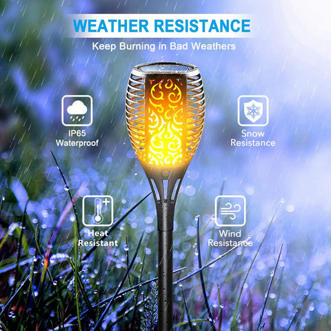Solar Torch Lights With Flickering Flame For Outdoor Yards And Pathways, Waterproof IP65 Tiki Torches showcased in rainy garden