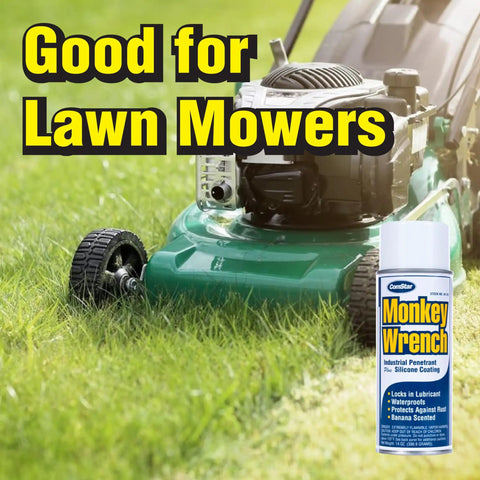 Lawn mower on grass with Monkey Wrench Lubricant Spray That Frees Rusted Bolts And Nuts Fast, Displaces Water, Protects Metal, Locks In Lubricant, Breaks Down Rust, Industrial Strength Formula, 14 Ounces Aerosol Can Made In USA in foreground