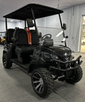 Top Tier Electric Golf Cart 4 Seater Loaded Up With 48V Power Motor Premium Stitched Seats All Terrain Capable Heavy Duty Weekend Warrior Smooth Riding Daily Hauler In Black with spacious seating.
