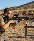 Man holding One To One Scale MK14 Style Gun Block Set With 1568 Pieces Ultra Detailed Military Sniper Rifle Model Kit for display.