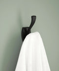 Matte Black Double J Towel Hook Wall Mounted For Robes And Towels, 2-Prong Holder, showing a white towel hanging on a wall