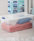 Extra Large Clear Storage Bin with Lid Stackable Plastic Tote Hella Spacious Snap Latch for storing blankets and cushions.
