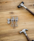 Heavy Duty Toggle Clamp Latch With Adjustable Lock Hole Stainless Steel Kit on wood surface with hammers.