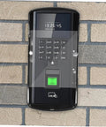 Weatherproof Rain Guard Cover For Outdoor Face Recognition Attendance Systems, Keypads And Doorbells, Easy Installation Shield protecting a keypad on a brick wall with rain droplets visible.