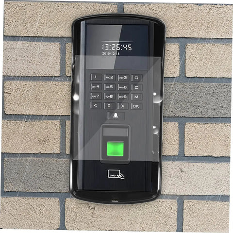 Weatherproof Rain Guard Cover For Outdoor Face Recognition Attendance Systems, Keypads And Doorbells, Easy Installation Shield protecting a keypad on a brick wall with rain droplets visible.
