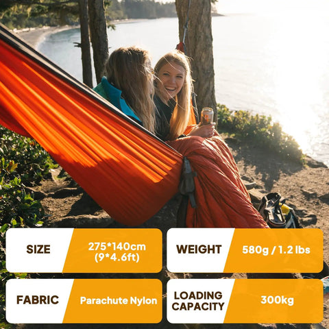 Two people relaxing in Ultra Light Travel Camping Hammock With 300kg Load Capacity 275x140 Cm Parachute Nylon by a lakeside