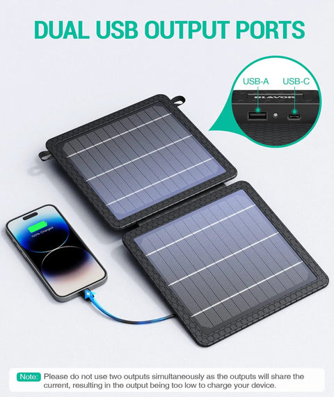 On The Go 10W Foldable Solar Charger With USB C And USB A Outputs connected to phone, showcasing dual solar panels and output ports.