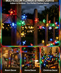 Solar Flower String Lights Outdoor Waterproof 50 LED Fairy Lights Sun Powered For Garden Fence Patio Yard Christmas Tree And Party Decor Multi Color No Fuss Setup glowing on a wooden fence.