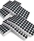 Hella Durable Self Adhesive Felt Pads Black Round Furniture Glides stacked sheets of 20mm thick pads for floor protection.