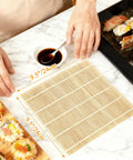 Person using Bamboo Sushi Rolling Mat Set Of 4 Pcs For Homemade Maki Kimbap And Rolls Natural Wood Mats with soy sauce and sushi